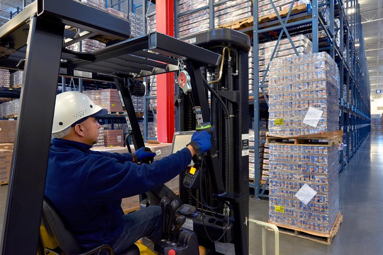 Warehouse Worker Solving Solutions Using a DS3608-HD Ultra-Rugged Scanner to Scan a Pallet