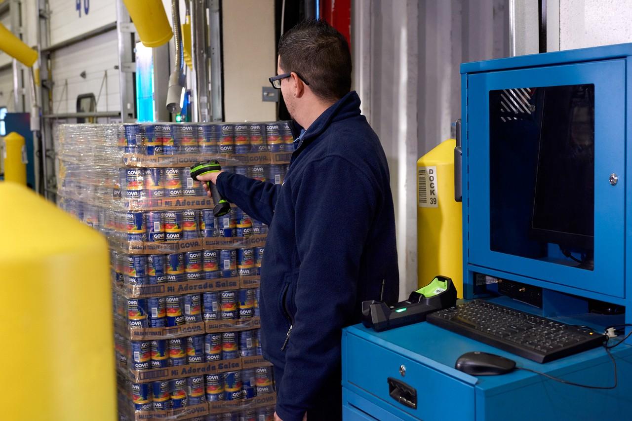 Warehouse Worker Using a DS3678-HP Ultra-Rugged Scanner to Scan a Food Pallet