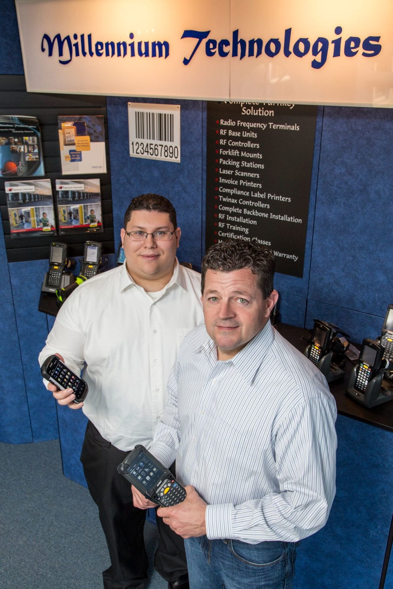 Millennium Technologies Employees holding Mobile Computers and Scanners for Services